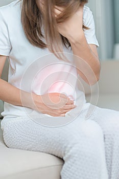 woman having abdomen ache due to Stomach pain, digestion with constipation or Diarrhea from food poisoning, female problem and