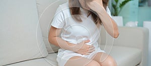 woman having abdomen ache due to Stomach pain, digestion with constipation or Diarrhea from food poisoning, female problem and