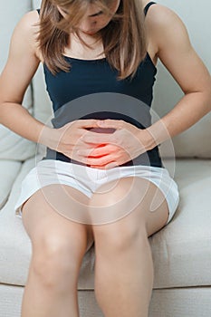 woman having abdomen ache due to Stomach pain, digestion with constipation or Diarrhea from food poisoning, female problem and