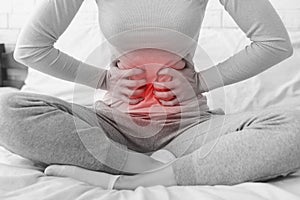 Woman having abdominal pain or menstrual cramps