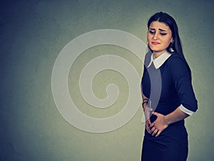 Woman having abdominal pain upset stomach or menstrual cramps