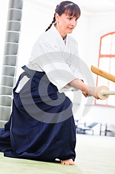 Woman having Aikido sword fight