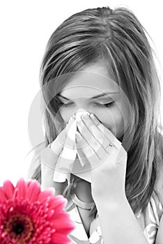 Woman having allergy from spring flowers