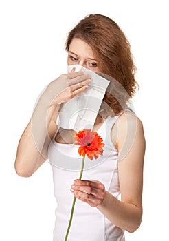 Woman having allergy from spring flowers