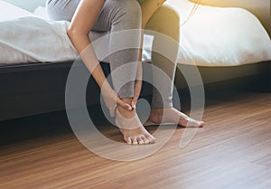 Woman having ankle,leg pain,Female feeling exhausted and painful