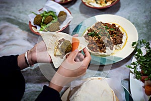 Woman having Arabic food in a restaurant
