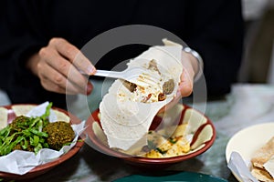 Woman having Arabic food in a restaurant