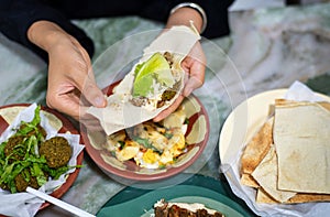 Woman having Arabic food in a restaurant