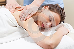 Woman having arm massage in spa