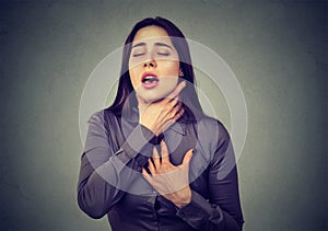 Woman having asthma attack or choking can`t breath suffering from respiration problems