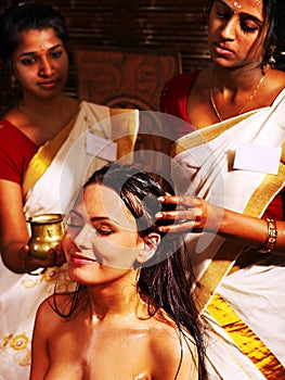 Woman having ayurveda spa treatment. photo