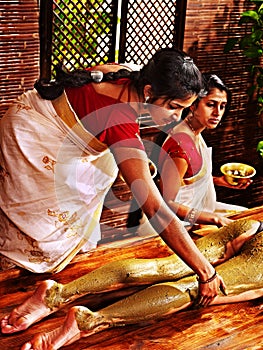 Woman having Ayurvedic feet spa massage.