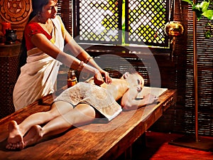 Woman having Ayurvedic spa treatment.
