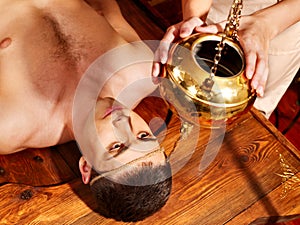 Woman having Ayurvedic spa treatment.