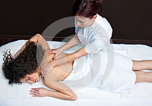 Woman having back adjustment