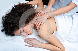 Woman having back adjustment