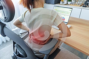 Woman having back body pain during work long time on workplace. due to Piriformis, Low Back, waist ache, lumbago, kidney,