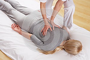 Woman having back massage from a professional