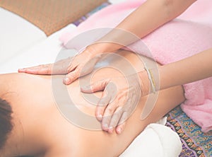 Woman is having back massage in Spa