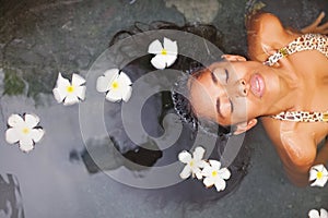 Woman having bath in a luxury spa salon