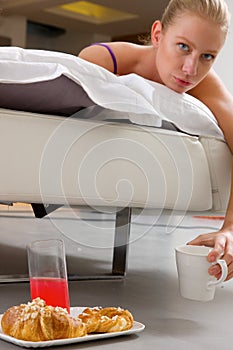 Woman having breakfast in bed