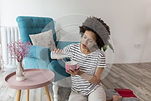 Woman having breakfast at home