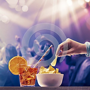 Woman having a cocktail at the nightclub