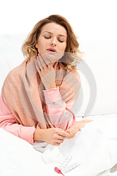 Woman having a cold, flu. Sore throat and coughing