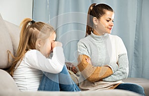 Woman having communication conflict with small daughter crying