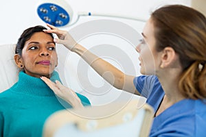 Woman having consultation at aesthetic medicine clinic