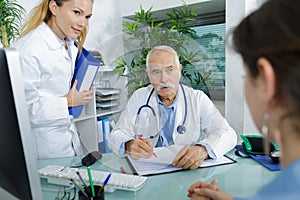 woman having consultation with docto and nurse