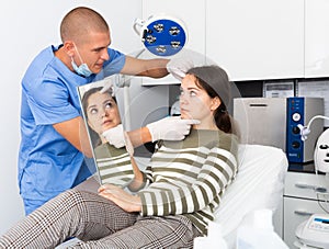 Woman having consultation with doctor in clinic