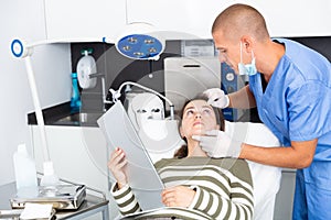 Woman having consultation with doctor in clinic