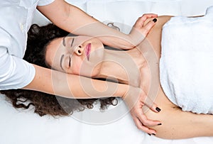 Woman having cyropractick neck adjustment