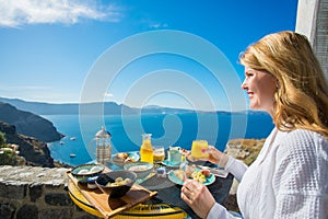 Woman having delicious breakfast in luxurious resort in Mediterranean