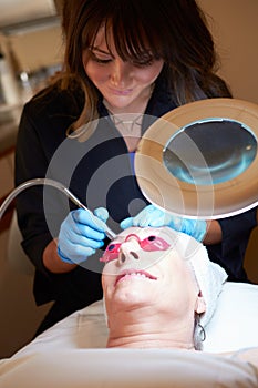 Woman Having Dermo Abrasion Cosmetic Treatment At Spa