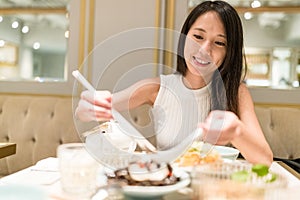 Woman having dinner in chinese restaurant