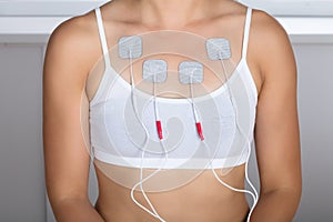 Woman Having Electrotherapy On Chest