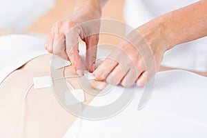 Woman having electrotherapy photo