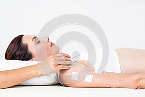 Woman having electrotherapy photo