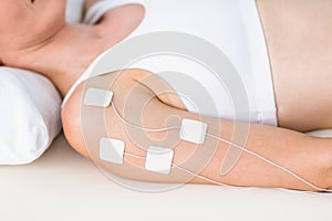 Woman having electrotherapy photo