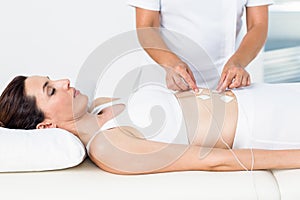 Woman having electrotherapy photo