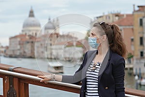 Woman having excursion on Accademia bridge in Venice, Italy
