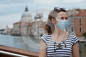 Woman having excursion on Accademia bridge in Venice, Italy