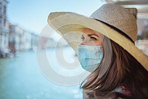 Woman having excursion on vaporetto water bus in Venice, Italy