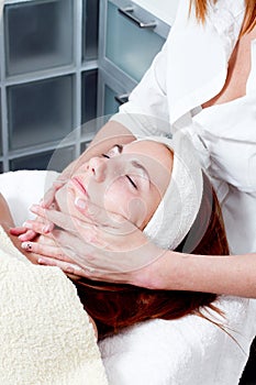 Woman having facial beauty treatment