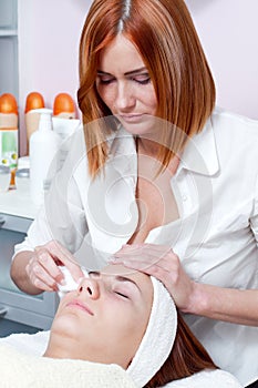 Woman having facial beauty treatment