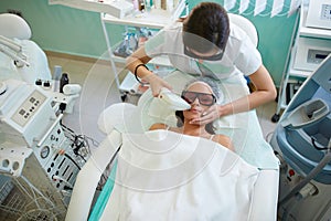 Woman having facial hair removal with laser