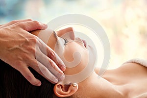 Woman having facial massage.