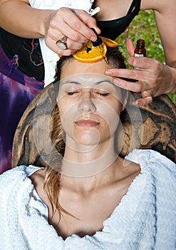 Woman having facial treatment